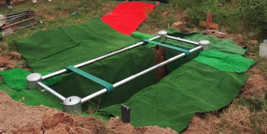 Graveside lowering device prepared for a burial