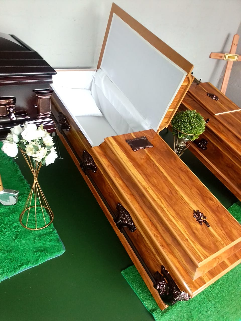 Handcrafted wooden coffins on display